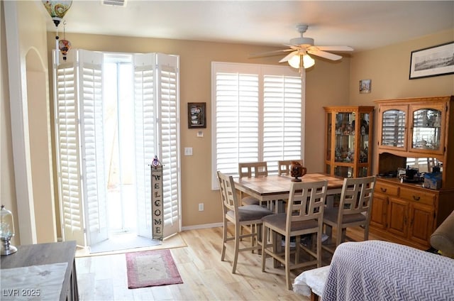 dining room featuring ceiling fan and light hardwood / wood-style flooring