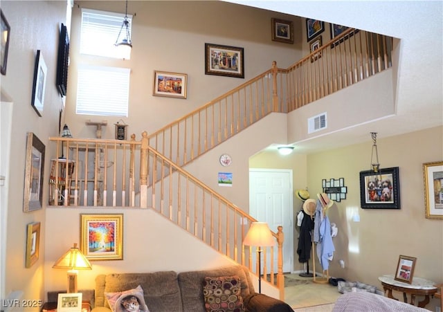 living room featuring a high ceiling