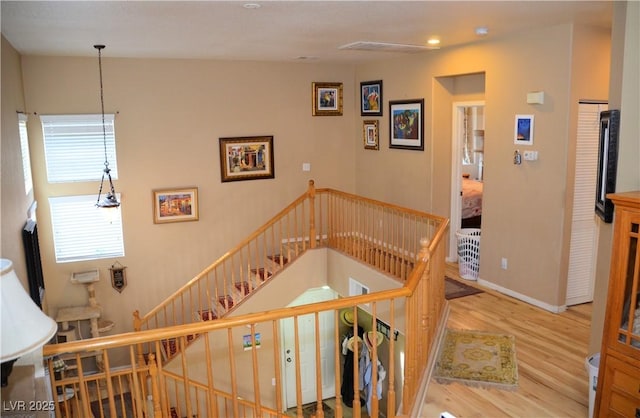 stairway with wood-type flooring