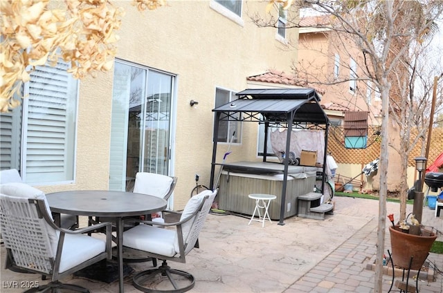 view of patio / terrace featuring a hot tub