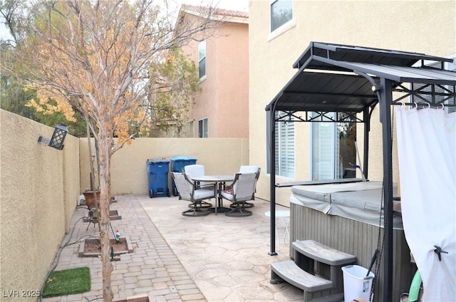 view of patio / terrace featuring a hot tub