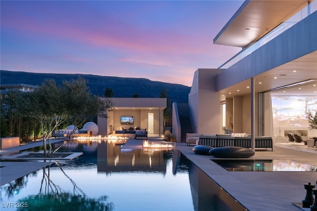 view of swimming pool with an outdoor living space and a patio