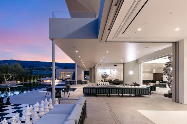 patio terrace at dusk with an outdoor hangout area