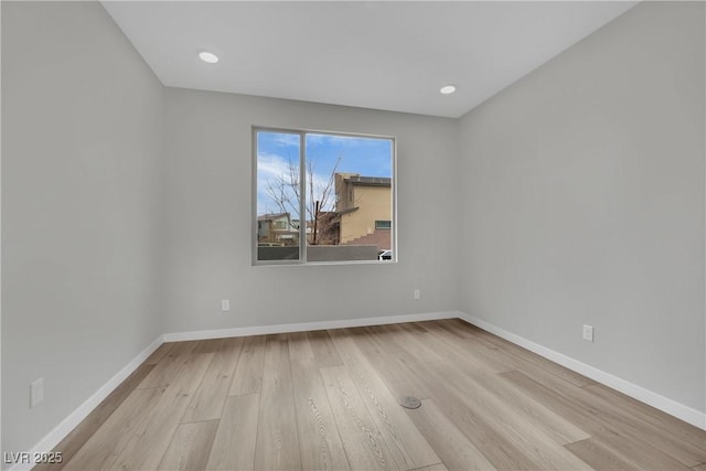 unfurnished room with light hardwood / wood-style flooring