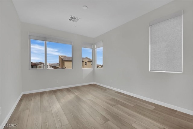 unfurnished room featuring light hardwood / wood-style flooring