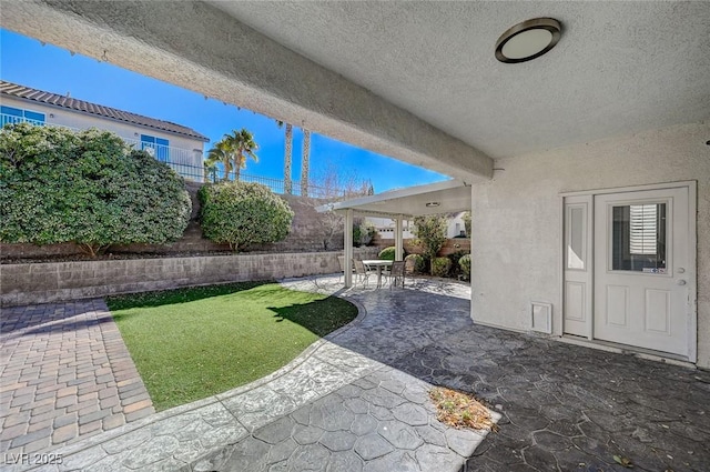 view of yard with a patio area and fence