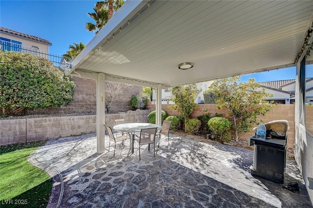 view of patio / terrace featuring outdoor dining space and a fenced backyard