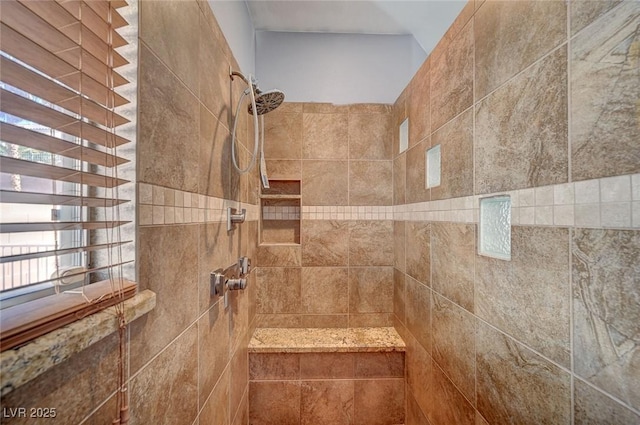 full bath with tiled shower