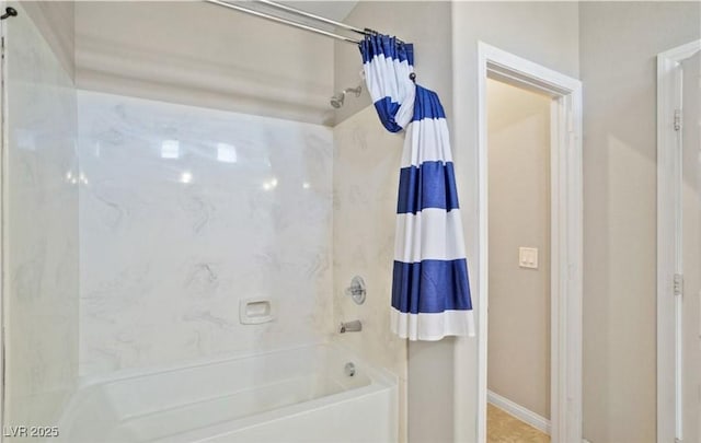 bathroom with shower / tub combo with curtain