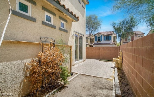 view of home's exterior featuring a patio