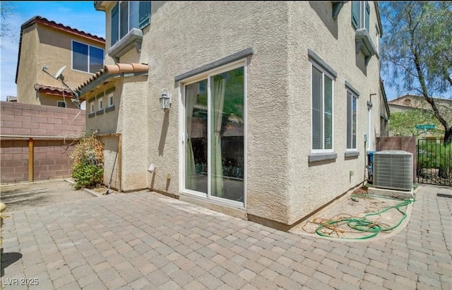 view of property exterior featuring a patio and central air condition unit