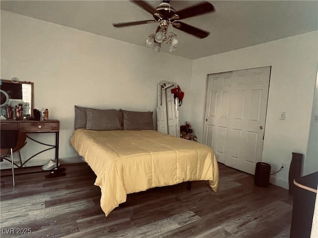 bedroom with dark wood-type flooring and ceiling fan