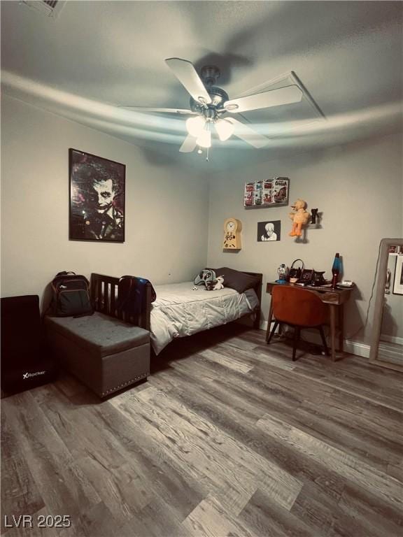 bedroom featuring hardwood / wood-style floors and ceiling fan