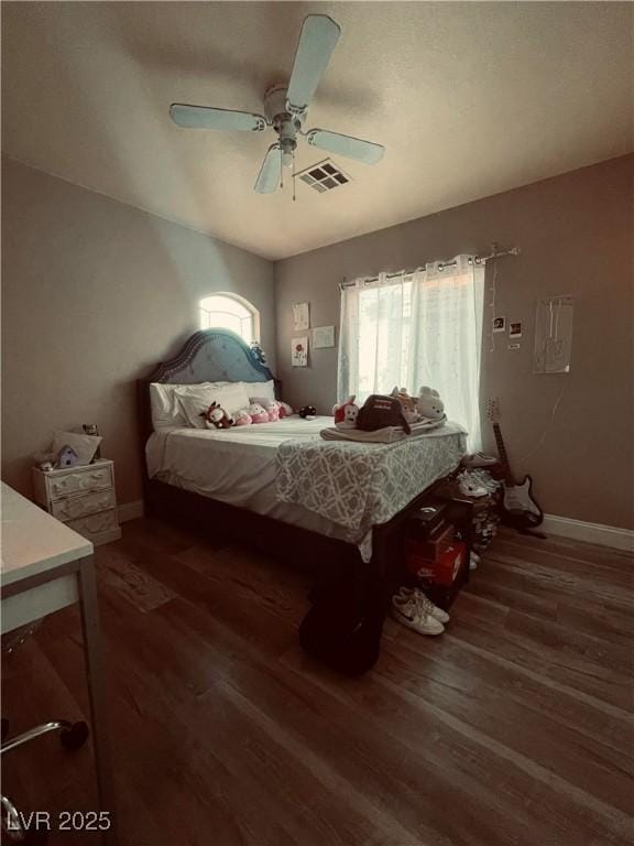 bedroom featuring dark wood-type flooring and ceiling fan