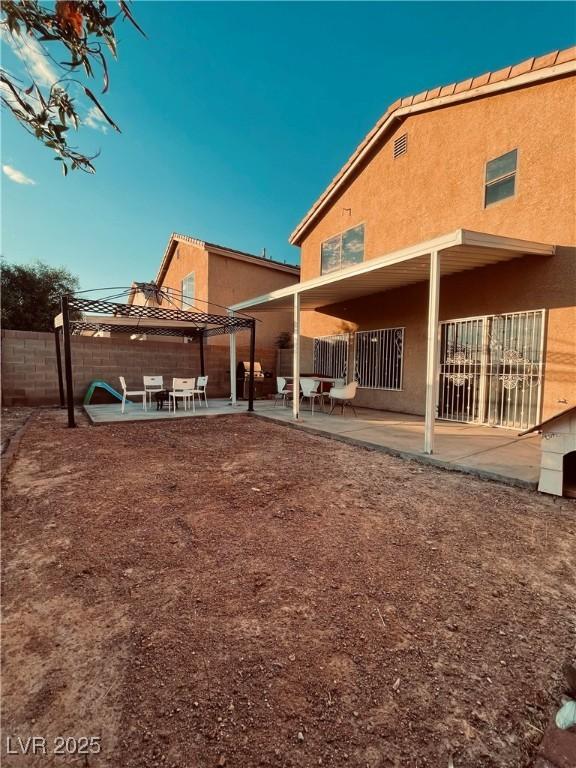 back of property with a patio area