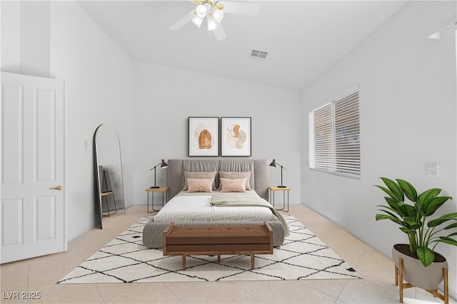 bedroom featuring visible vents, vaulted ceiling, a ceiling fan, and light tile patterned flooring