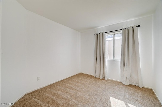 empty room featuring light colored carpet