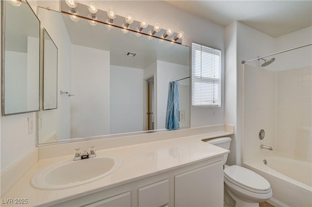 full bathroom featuring vanity, shower / tub combo with curtain, and toilet