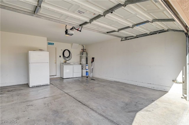 garage featuring a garage door opener, washing machine and dryer, white fridge, and water heater