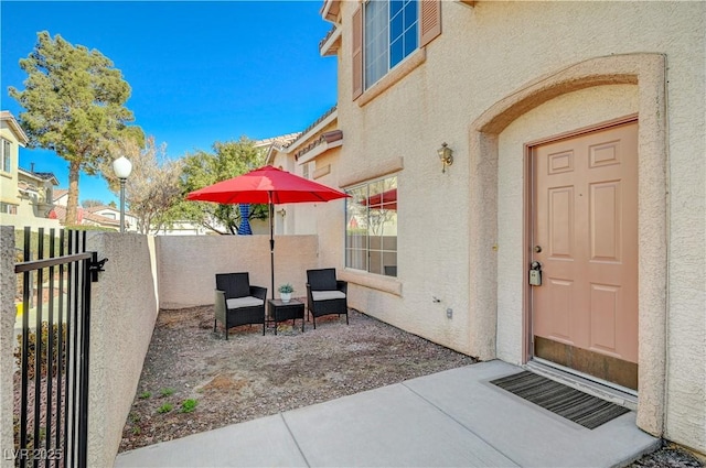 property entrance featuring a patio