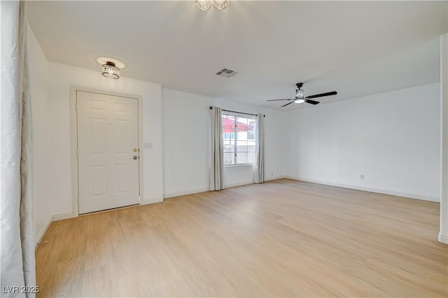 unfurnished room featuring ceiling fan and light wood-type flooring