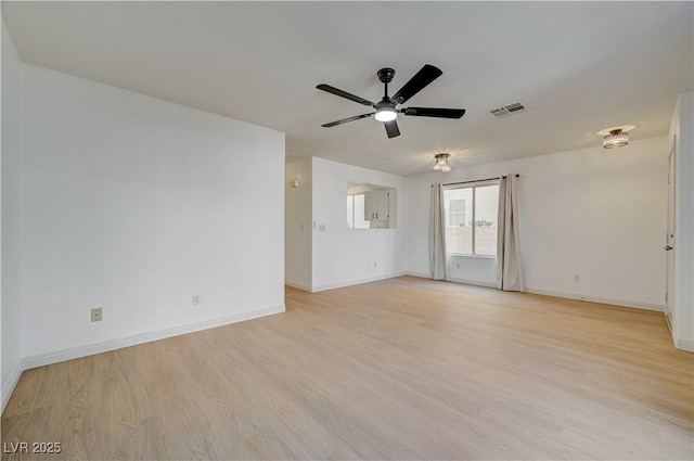 spare room with light hardwood / wood-style flooring and ceiling fan