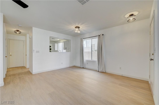 empty room with light hardwood / wood-style floors