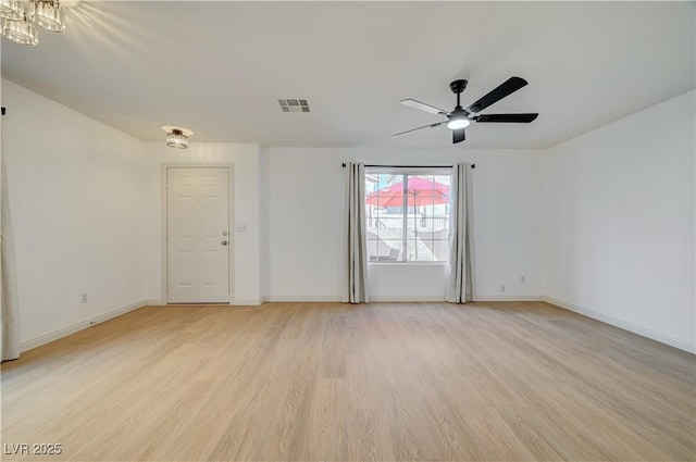 empty room featuring light hardwood / wood-style flooring and ceiling fan