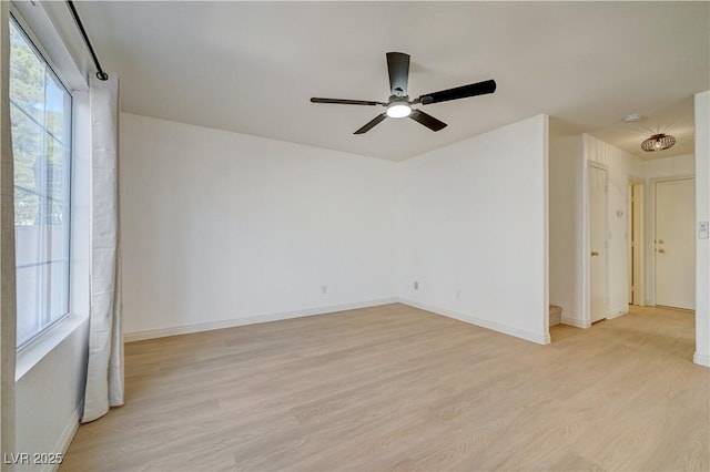 spare room featuring ceiling fan and light wood-type flooring