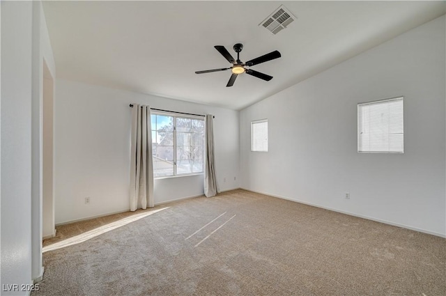 carpeted empty room featuring lofted ceiling and ceiling fan