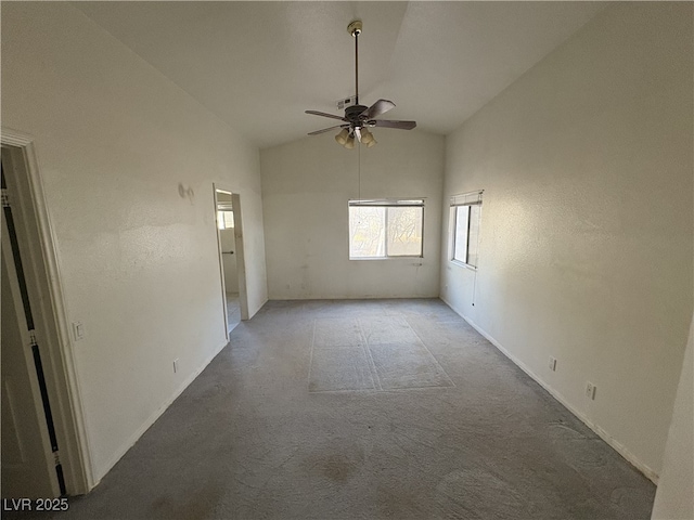 empty room with high vaulted ceiling and ceiling fan