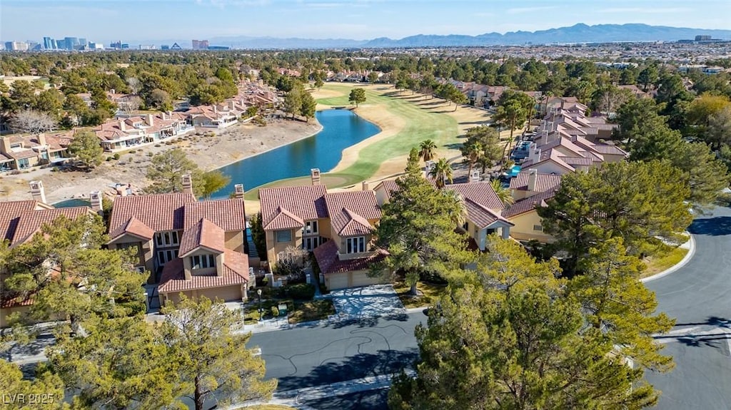 drone / aerial view featuring a water and mountain view