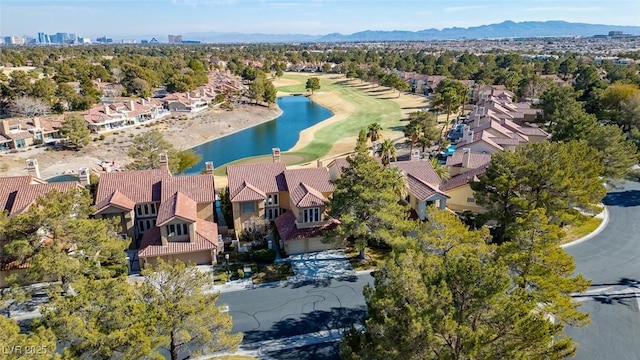 drone / aerial view featuring a water and mountain view