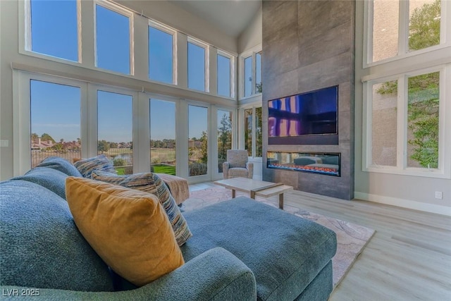 sunroom / solarium with a fireplace