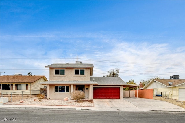 view of front of property with a carport and central AC