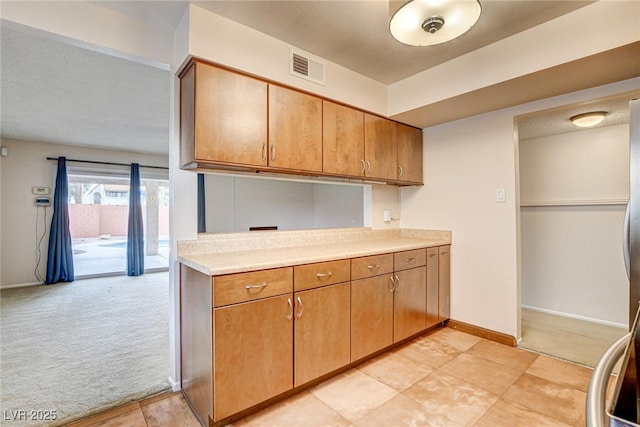 kitchen with light carpet