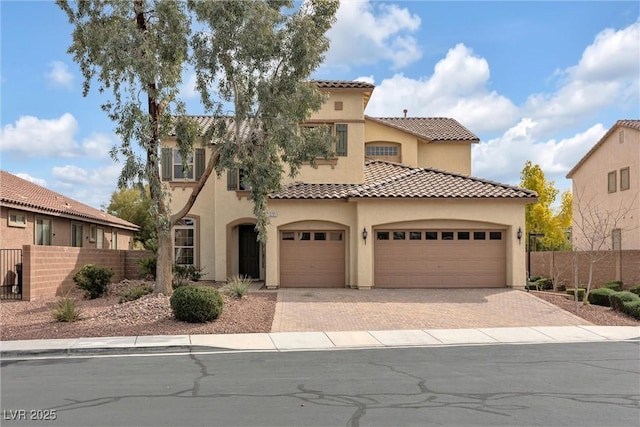 mediterranean / spanish-style house featuring a garage