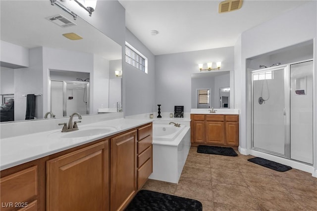 bathroom featuring vanity and plus walk in shower