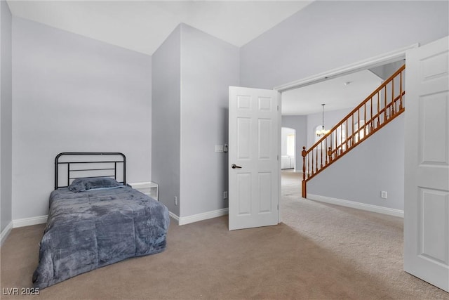 bedroom with a chandelier and carpet