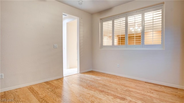 unfurnished room featuring light hardwood / wood-style floors