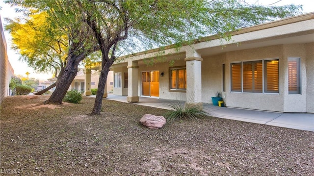 rear view of property with a patio