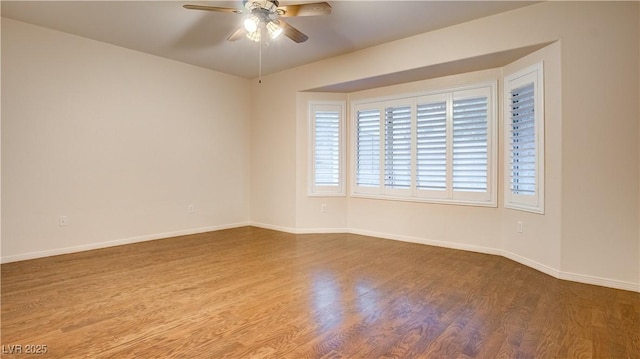 unfurnished room with wood-type flooring and ceiling fan