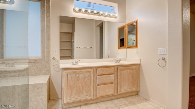 bathroom featuring vanity and plenty of natural light