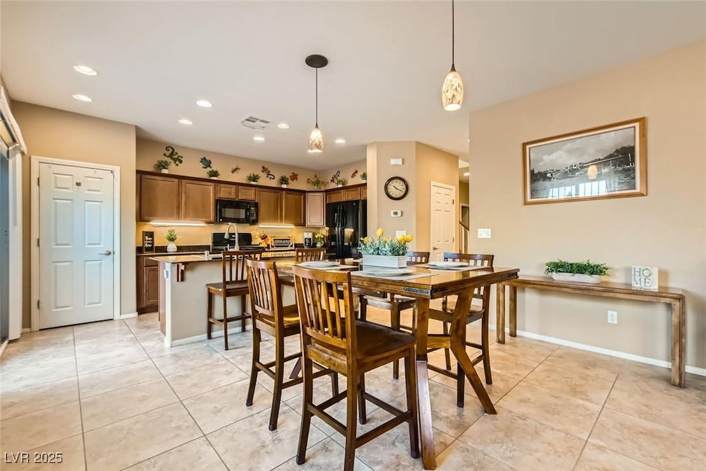 dining area featuring light tile patterned floors