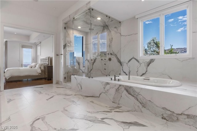 bathroom featuring shower with separate bathtub