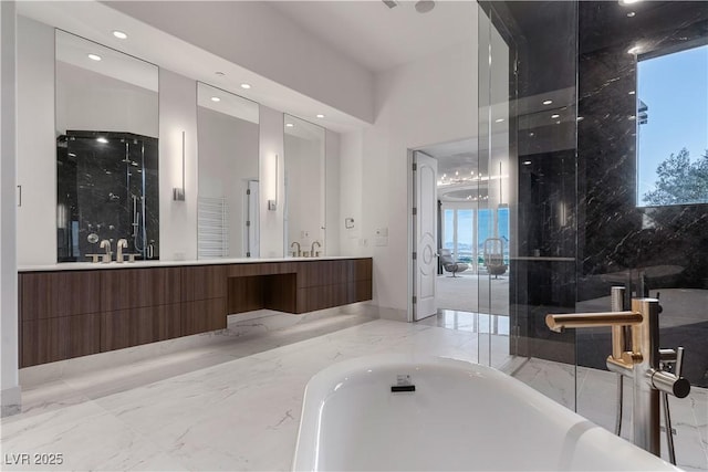 bathroom featuring vanity and shower with separate bathtub