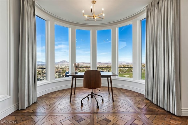 home office featuring an inviting chandelier, parquet floors, and a wealth of natural light