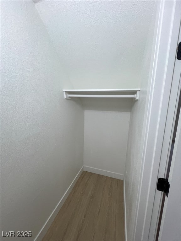 walk in closet featuring wood-type flooring