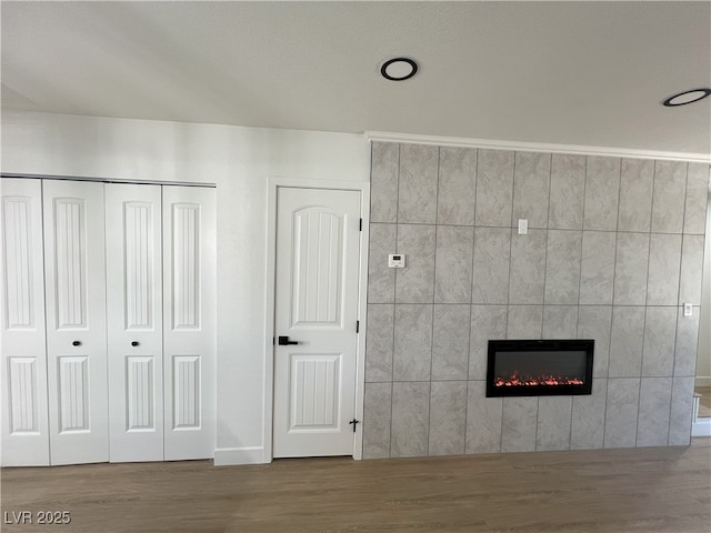 interior space with a fireplace and hardwood / wood-style floors