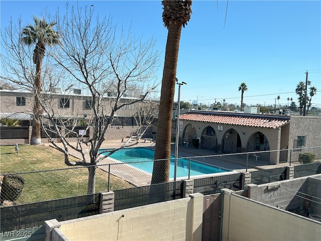 view of pool featuring a patio area and a lawn